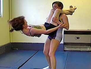 Two babes in gym wear wresting and cat fighting
