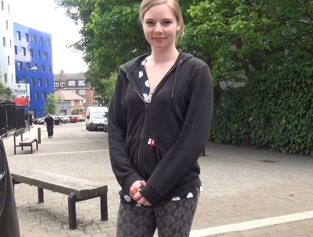 Alice changes out of her leggings into a short skirt outdoors